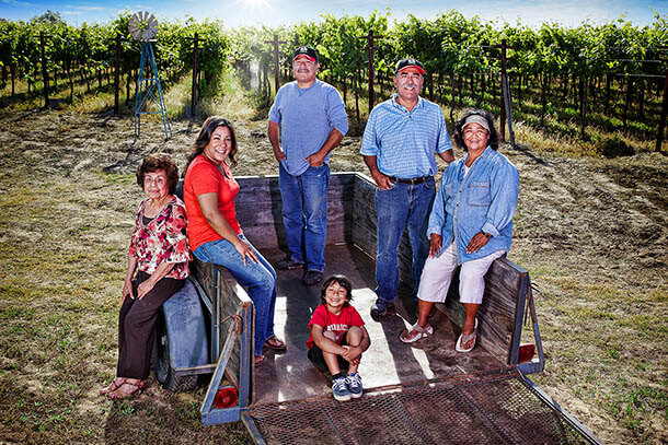 One of Sun-Maid's 750 grower families posing in front of their farm